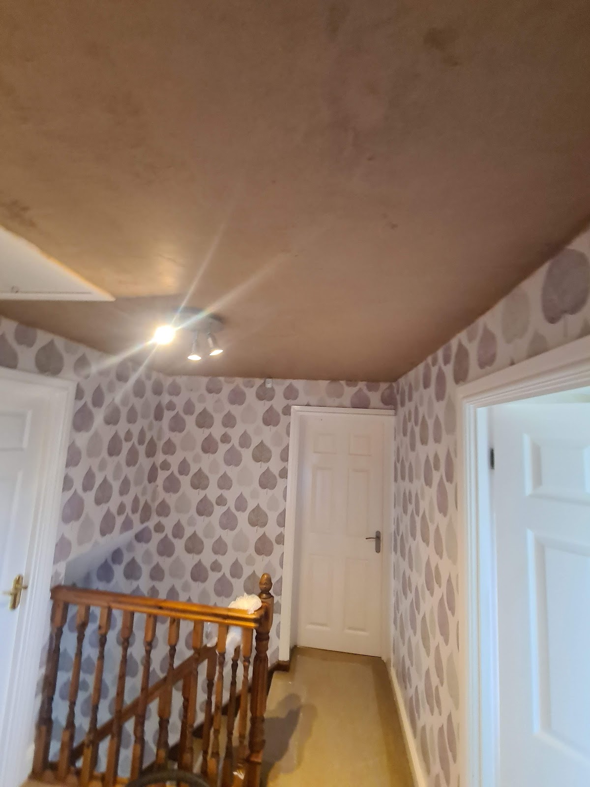Landing ceiling freshly skimmed by B.E. Plastering